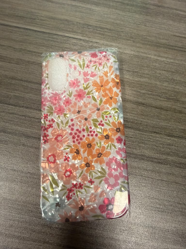 Clear phone case with pink and orange floral design