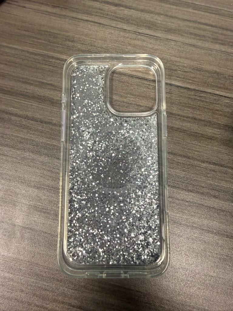 Clear phone case with silver glitter back