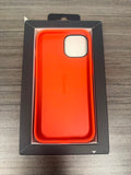 Speck red and orange phone case in open packaging