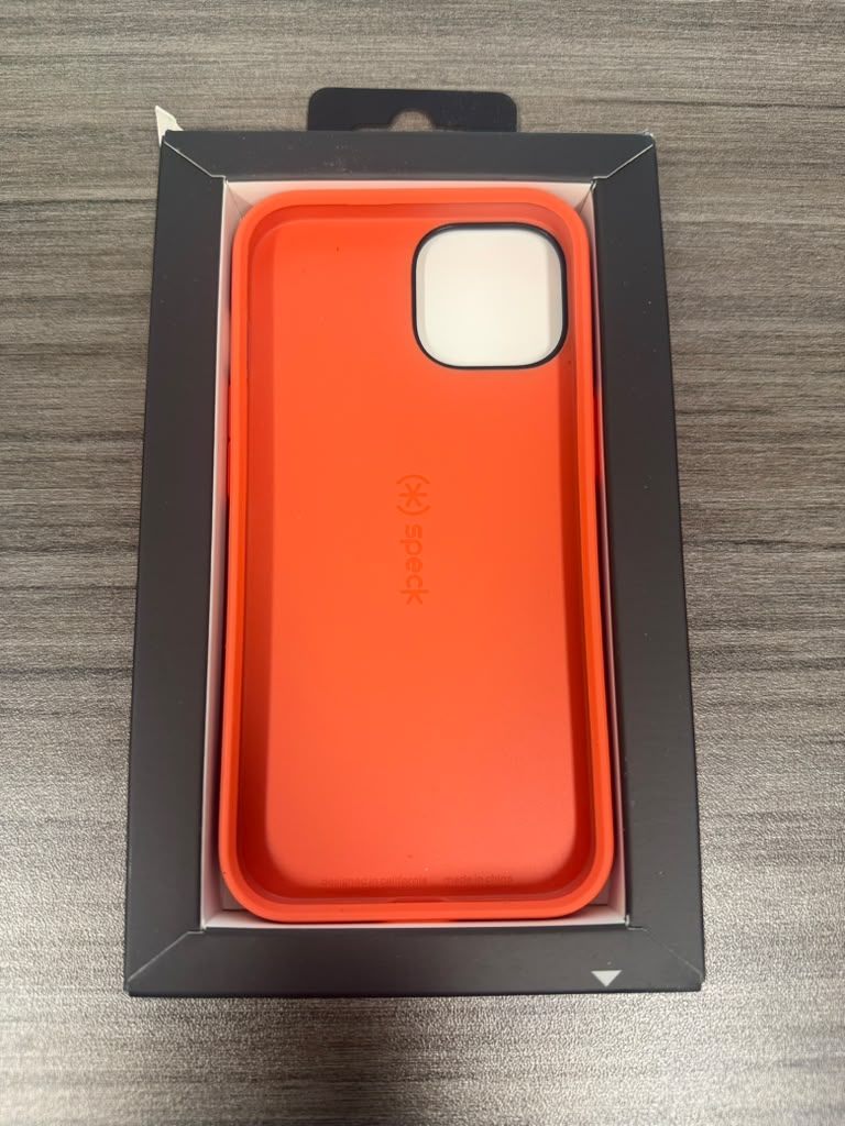 Speck red and orange phone case in open packaging